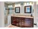 Bathroom with a double sink vanity, granite counters, and tiled shower with glass door at 848 Bucksaw Pl, Longwood, FL 32750