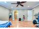 Spacious bedroom features hardwood floors, ceiling fan, recessed lighting, and closet at 848 Bucksaw Pl, Longwood, FL 32750
