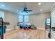 A simple bedroom with hardwood floors and a ceiling fan and neutral colored walls at 848 Bucksaw Pl, Longwood, FL 32750