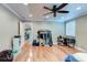 Spacious bedroom featuring hardwood floors, a ceiling fan and a desk at 848 Bucksaw Pl, Longwood, FL 32750