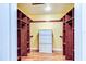 Walk-in closet boasts custom shelving, drawers, and ample storage space at 848 Bucksaw Pl, Longwood, FL 32750