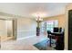 Bright dining area features tile floors, a bay window, and elegant chandelier lighting at 848 Bucksaw Pl, Longwood, FL 32750