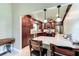 Well-equipped kitchen features stainless steel appliances, dark wood cabinetry, and a breakfast bar at 848 Bucksaw Pl, Longwood, FL 32750
