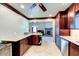 This kitchen boasts custom cabinetry, stainless appliances, and an extended countertop bar at 848 Bucksaw Pl, Longwood, FL 32750