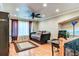 Spacious living area with hardwood floors, a daybed, and a staircase to the side at 848 Bucksaw Pl, Longwood, FL 32750