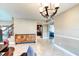 Living area with stylish geometric cabinet storage, tile floors, and neutral color palette at 848 Bucksaw Pl, Longwood, FL 32750