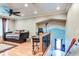 Spacious living area with hardwood floors, a ceiling fan, and a staircase to the side at 848 Bucksaw Pl, Longwood, FL 32750