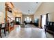Spacious living room featuring soaring ceilings, staircase, tile floors, and an abundance of natural light at 848 Bucksaw Pl, Longwood, FL 32750