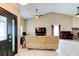 Well-lit living room featuring a vaulted ceiling, a piano, and a seamless flow for entertaining and relaxation at 848 Bucksaw Pl, Longwood, FL 32750
