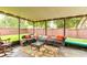 Inviting screened patio with stylish furniture, perfect for relaxing and enjoying the outdoor scenery at 848 Bucksaw Pl, Longwood, FL 32750