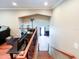 View of the stairwell with wooden stairs and railing leading to the lower level at 848 Bucksaw Pl, Longwood, FL 32750