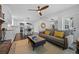 Inviting living room featuring hardwood floors, modern decor, and seamless integration with the kitchen area at 892 Breakwater Dr, Altamonte Springs, FL 32714