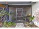 Relaxing screened porch featuring comfortable seating and stylish decor, perfect for entertaining at 892 Breakwater Dr, Altamonte Springs, FL 32714