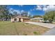 Single-Gathering home with a well-manicured lawn and a two-car garage at 905 Ida St, Wildwood, FL 34785