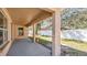 Enjoy the covered patio and the view of the grass and fenced yard at 905 Ida St, Wildwood, FL 34785