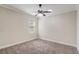 Bedroom features plush carpet, a window, and a ceiling fan with lights at 9058 Sw 89Th Loop, Ocala, FL 34481