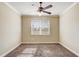 Bedroom features plush carpet, a window with blinds, and a ceiling fan with lights at 9058 Sw 89Th Loop, Ocala, FL 34481