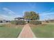 Beautiful community entrance with landscaping, brick pathway and pergola at 9058 Sw 89Th Loop, Ocala, FL 34481