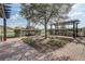 Community park with walking path, seating and trellised pergola at 9058 Sw 89Th Loop, Ocala, FL 34481