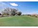 Picturesque community golf course with manicured green and mature trees at 9058 Sw 89Th Loop, Ocala, FL 34481
