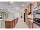 Beautiful kitchen with a large island, stainless steel appliances, and an open layout at 9058 Sw 89Th Loop, Ocala, FL 34481