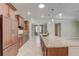 Spacious kitchen with a large island, granite countertops, and stainless steel appliances at 9058 Sw 89Th Loop, Ocala, FL 34481