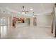 Open floor plan with tile flooring, tray ceilings, and a spacious kitchen at 9058 Sw 89Th Loop, Ocala, FL 34481