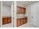 Walk-in pantry offering ample storage space and custom cabinets at 9058 Sw 89Th Loop, Ocala, FL 34481