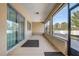 Covered porch with outdoor seating area overlooking the backyard, plus tile floors at 9058 Sw 89Th Loop, Ocala, FL 34481