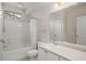 Bathroom with white vanity, tub, and shower at 911 N Orange Ave # 448, Orlando, FL 32801