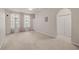 Bright bedroom with neutral walls, carpet, and double door closet at 911 N Orange Ave # 448, Orlando, FL 32801