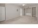 Bedroom with built-in shelving and neutral carpeting at 911 N Orange Ave # 448, Orlando, FL 32801