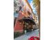 Residential building entrance with modern canopy, landscaping, and lighting at 911 N Orange Ave # 448, Orlando, FL 32801