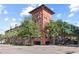 Upscale multi-story building with brick facade and lush landscaping at 911 N Orange Ave # 448, Orlando, FL 32801