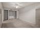 Living room with built-in shelving and neutral carpeting at 911 N Orange Ave # 448, Orlando, FL 32801