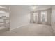 Spacious living room with neutral carpeting and large windows at 911 N Orange Ave # 448, Orlando, FL 32801