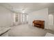 Bright living room with large windows and neutral carpeting at 911 N Orange Ave # 448, Orlando, FL 32801