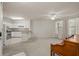 Open concept living room with kitchen and neutral decor at 911 N Orange Ave # 448, Orlando, FL 32801