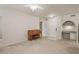 Open concept living room and entryway with neutral carpeting at 911 N Orange Ave # 448, Orlando, FL 32801