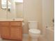 Simple bathroom with wood vanity and bathtub at 980 Crestwood Commons Ave, Ocoee, FL 34761