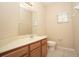 Clean bathroom with wood vanity and tile floor at 980 Crestwood Commons Ave, Ocoee, FL 34761