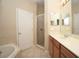 Bathroom with double vanity, shower, and garden tub at 980 Crestwood Commons Ave, Ocoee, FL 34761