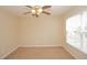 Well-lit bedroom with ceiling fan and large window at 980 Crestwood Commons Ave, Ocoee, FL 34761