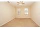 Spacious bedroom with neutral walls and carpet flooring at 980 Crestwood Commons Ave, Ocoee, FL 34761