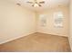 Bright bedroom featuring neutral walls and carpet flooring at 980 Crestwood Commons Ave, Ocoee, FL 34761