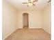 Carpeted bedroom with ceiling fan and access to hallway at 980 Crestwood Commons Ave, Ocoee, FL 34761