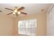 Bedroom with ceiling fan and window with blinds at 980 Crestwood Commons Ave, Ocoee, FL 34761