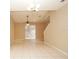 Spacious dining room with tile floors and a chandelier at 980 Crestwood Commons Ave, Ocoee, FL 34761