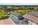 Elevated aerial view of homes highlighting community amenities, serene landscaping, and manicured lawns at 1015 Jack Nicklaus Ct, Kissimmee, FL 34747
