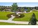 Aerial view of a well-maintained park with walking paths, playground, and green spaces at 1015 Jack Nicklaus Ct, Kissimmee, FL 34747